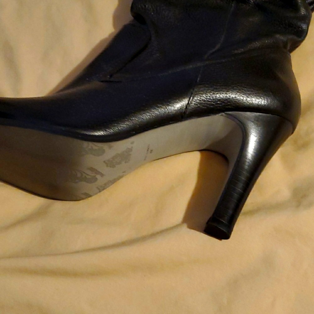 A pair of Black Boots Worn 1 time for 30 minutes